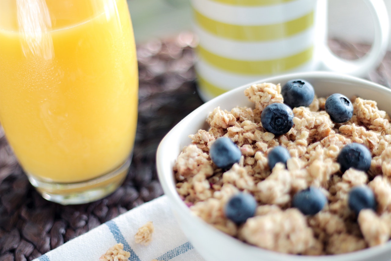 A bowl full of oatmeal and blueberries