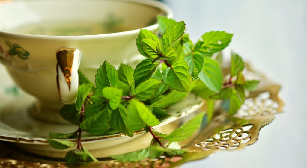 a cup of peppermint tea to relieve pain