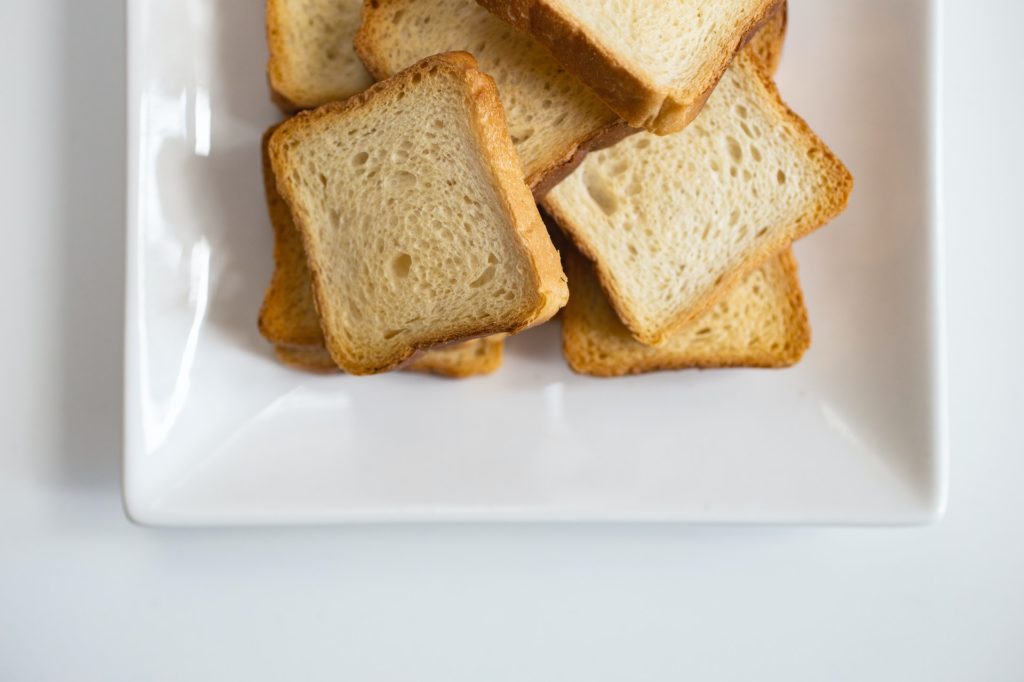 Slices of white toast on a white plate