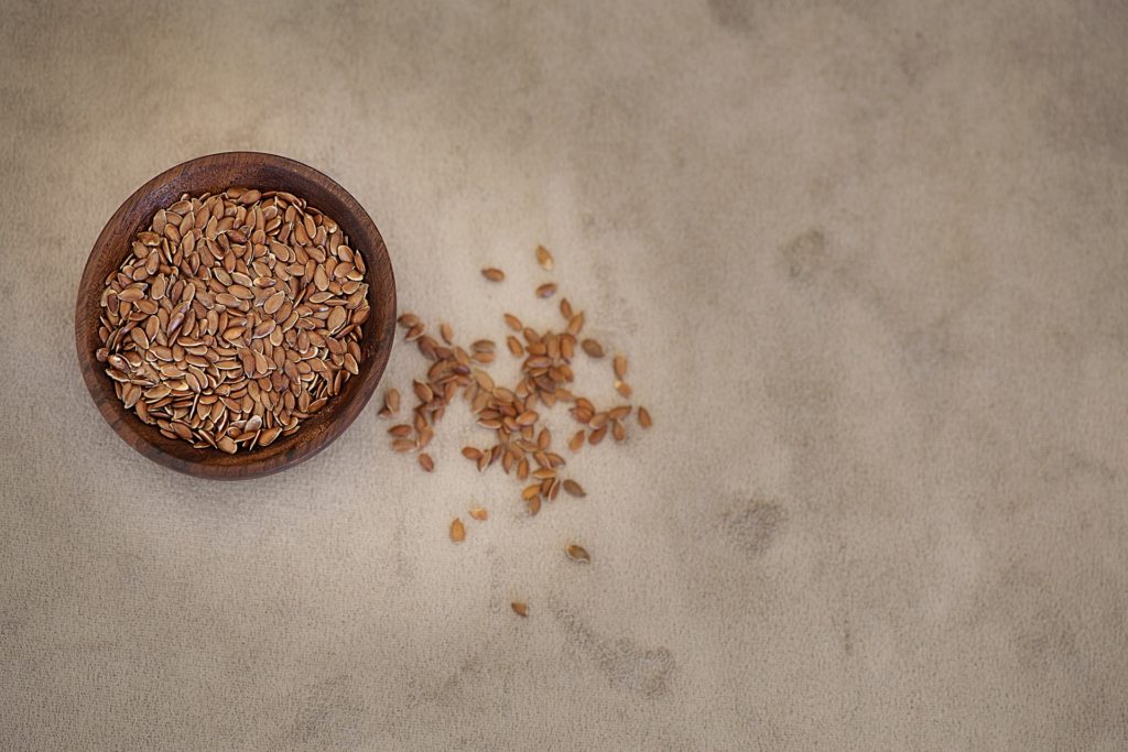 A small bowl full of flaxseeds